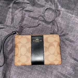 Coach bag can hold cash,cards, and jewelry.